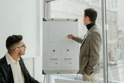 Two workers discuss Merillot Job Lab