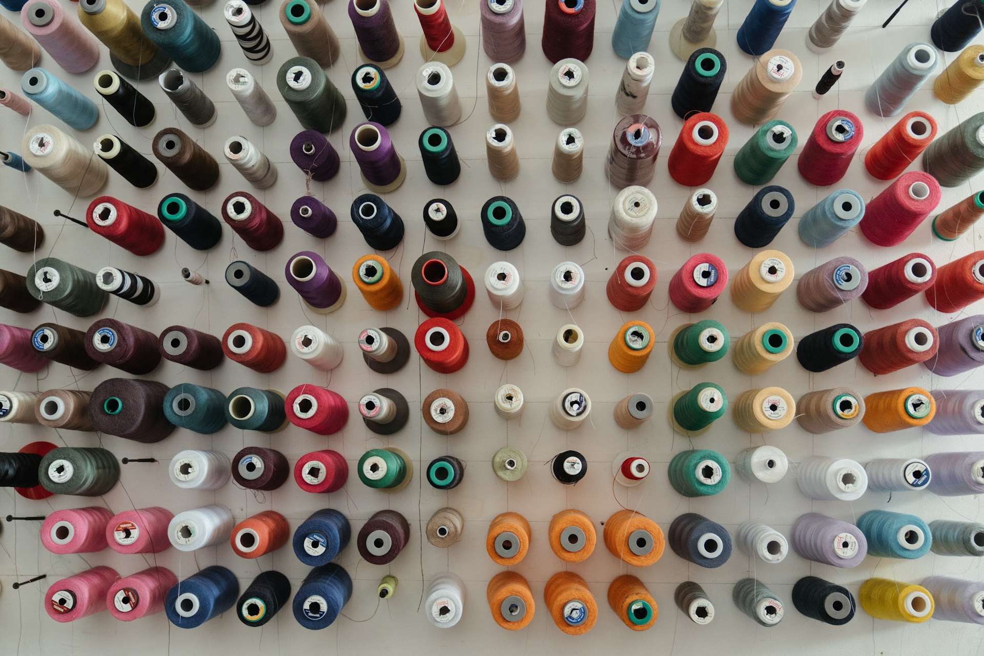 cotton spools of various colours representing transformative inclusivity